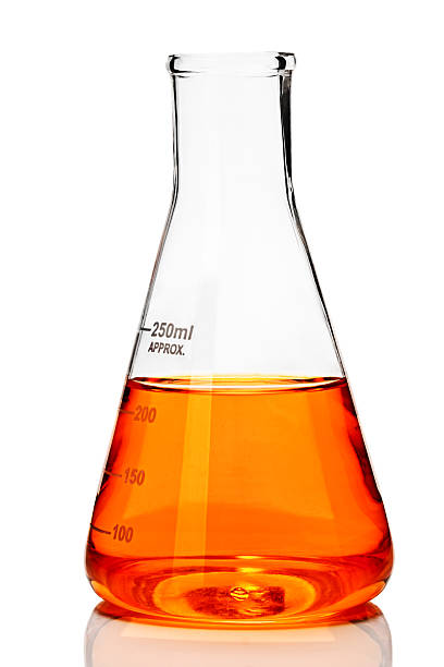 Laboratory glassware Chemistry conical flask with orange liquid beaker stock pictures, royalty-free photos & images