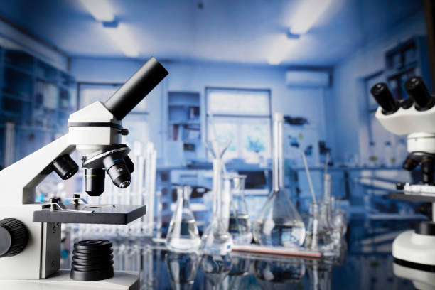 Laboratory investigations concerning test and medicine against covid. Microscope, glass tubes and beakers in the laboratory. histology stock pictures, royalty-free photos & images