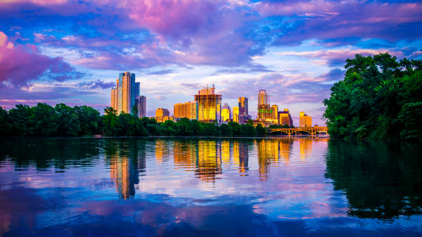 Lady bird lake purple reflections of a golden city A modern growing Austin Texas skyline downtown Lady bird lake purple reflections of a golden city austin texas stock pictures, royalty-free photos & images
