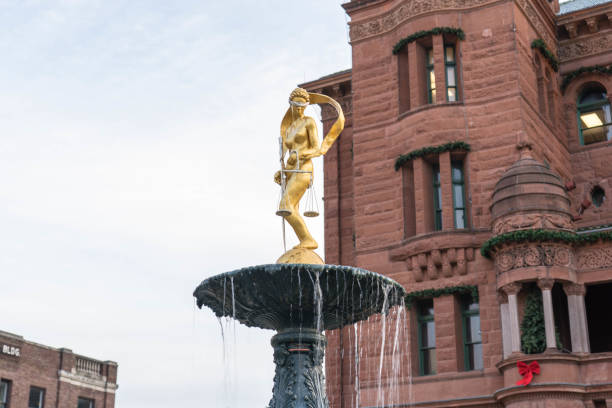 Lady Justice Statue on Water Fountain in front of Court House stock photo