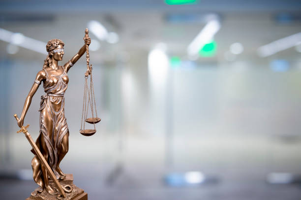 Lady Justice Statue with Defocused Office Background stock photo