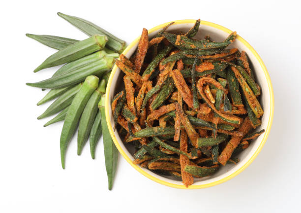 ladyfinger or okra fry Kurkuri bhindi or crispy ladyfinger or okra fry recipe, served in a bowl with raw okra okra photos stock pictures, royalty-free photos & images