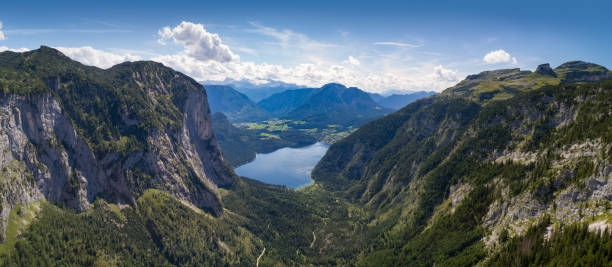 Lake Altaussee, Austria - Huge Aerial Panorama Aerial Panorama of the beautiful Lake Altaussee with the Mountains Trisselwand, Glacier Dachstein, Sarstein and Loser in the middle auf the Austrian Alps. Nature Reserve. Steiermark. Ausseerland. A hot spot for paragliding! ausseerland stock pictures, royalty-free photos & images