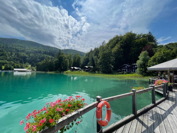 Lake Fuschlsee Fuschl am See, Austria - July 31 2021: The Hotel Schloss Fuschl luxury resort on the shore of lake Fuschl near Salzburg fuschl lake stock pictures, royalty-free photos & images
