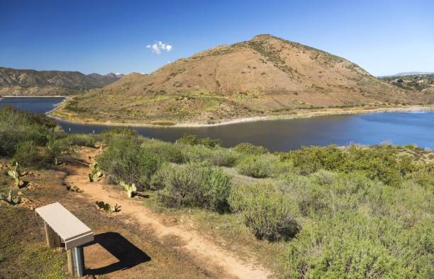 Lake Hodges and Bernardo Mountain Scenic Landscape in San Diego County Scenic Landscape View of Lake Hodges and Bernardo Mountain with Picnic Bench in the Foreground San Diego County North Inland near California Interstate 15 lake hodges stock pictures, royalty-free photos & images