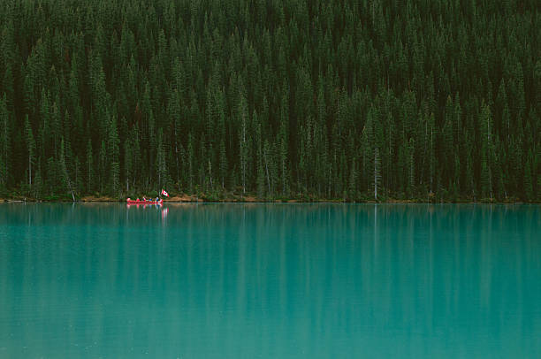 Lake Louise with Canoeists stock photo