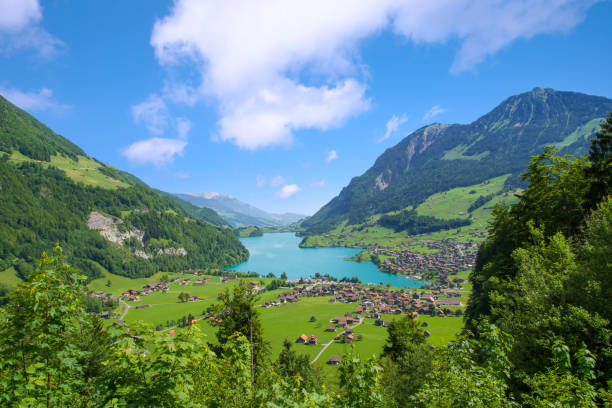 Lake Lungern Valley from Brunig Pass between Lucerne and Interlaken, Switzerland Lake Lungern Valley from Brunig Pass between Lucerne and Interlaken, Switzerland lungern village switzerland lake stock pictures, royalty-free photos & images