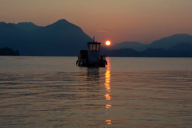 Lake Maggiore waking up with a sunrise, near Baveno stock photo