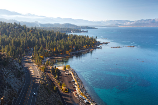 Highway 50 winding around the east shore of Lake Tahoe in Nevada on an Autumn morning.