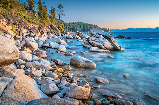 Round stones on the shores of Lake Tahoe, near Sand Harbor, Nevada, USA during sunset.