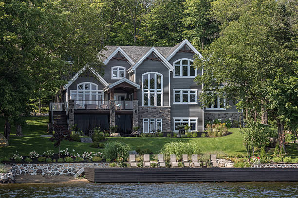 Lakefront Luxury Property on Sunny Day of Summer Lac St-Joseph, Сanada - August 18, 2015: Luxurious lakefront property located in Lac St-Joseph, a rich suburb of Quebec City on a sunny day of summer. waterfront photos stock pictures, royalty-free photos & images