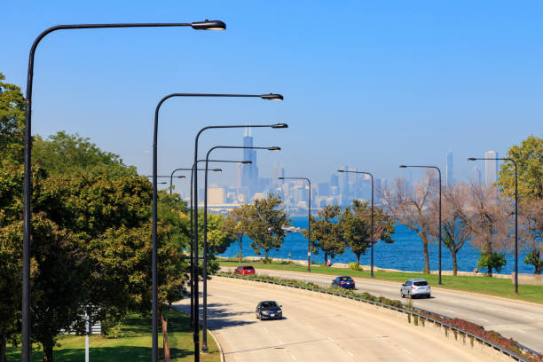 Lakeshore Drive Chicago Chicago skyline seen from Lakeshore Drive in the South Side of Chicago, IL, USA. lakeshore stock pictures, royalty-free photos & images