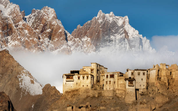 Lamayuru Monastery - Ladakh The Lamayuru monastery stands dramatically in contrast with the mountains behind on a cold morning in India's Ladakh region lamayuru stock pictures, royalty-free photos & images