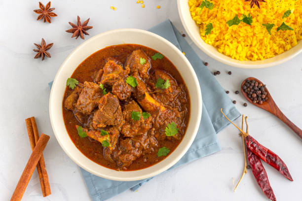 Lamb Curry / Lamb Vindaloo in a Bowl on White Background stock photo