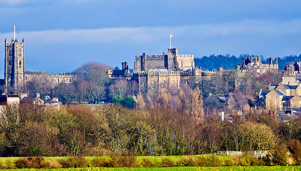 Lancaster Cityscape UK Cityscape of Lancaster featuring the Castle & Priory from the lune marshes lancashire stock pictures, royalty-free photos & images