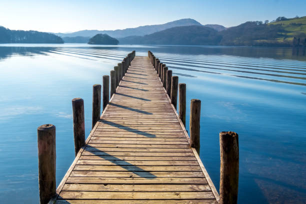 Landing Stage on Coniston Water, English Lake District, Cumbria, UK Wooden landing stage on Coniston Water. jetty stock pictures, royalty-free photos & images