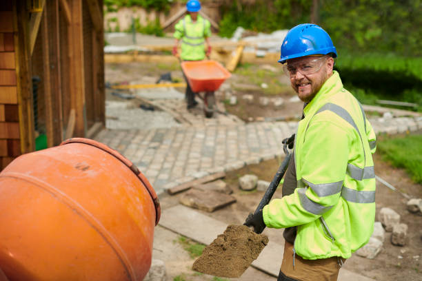 landscape contractor loading the cement mixer stock photo