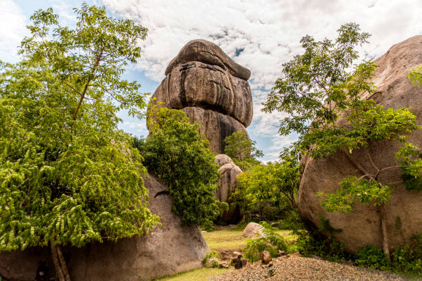 Landscape of Kit Mikayi, an impressive balancing rock formation or tor, around 40 m high, in Seme, Kisumu County, western Kenya, Africa. stock photo