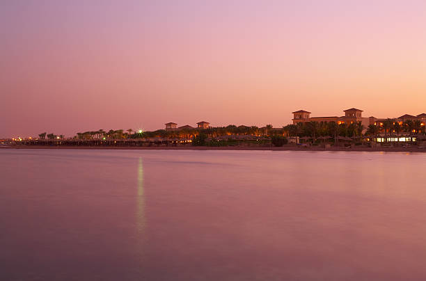 Landscape sunset on Red Sea - pink still water, sky stock photo