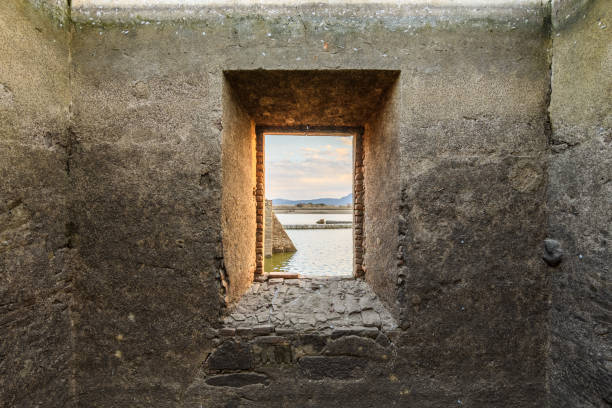 landscape through a window of a few ruins stock photo