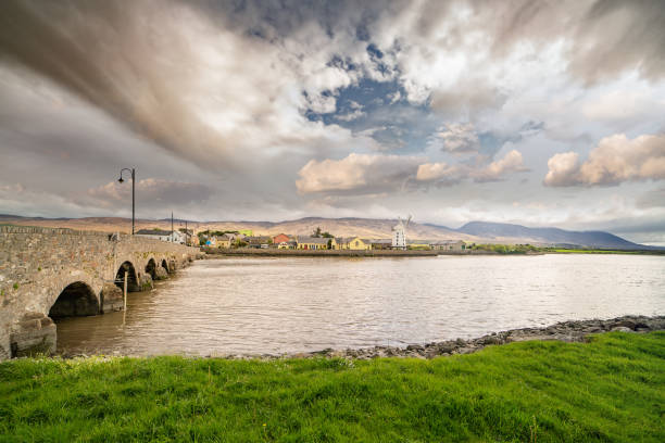 Landscape with a bridge and an old windmill  at Blennerville in Tralee Bay. stock photo