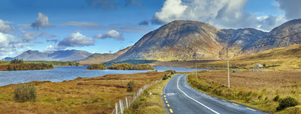 Landscape with Inagh lake, Ireland Panopramic landscape with Inagh lake and mountains in Galway county, Ireland connemara stock pictures, royalty-free photos & images