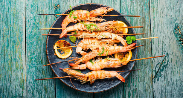 Langoustines or prawns on a skewer,top view stock photo