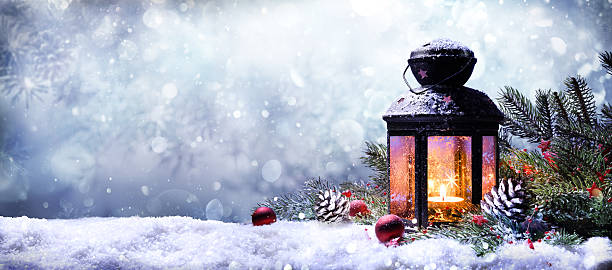 lantern with fir branches on snow - buiten de steden gelegen gebied stockfoto's en -beelden