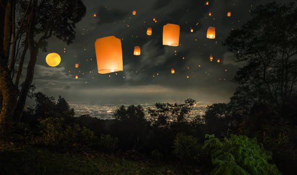 lanterns flying in sky in Loy Krathong stock photo