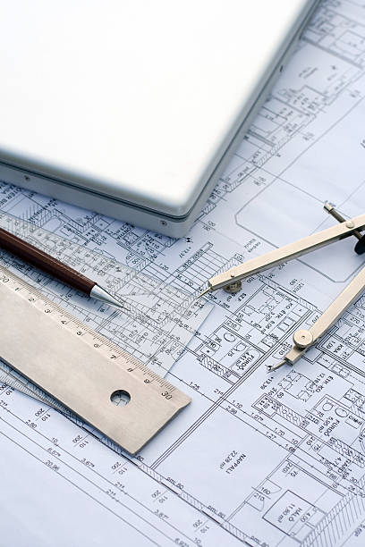 Laptop and tools on a blueprint stock photo