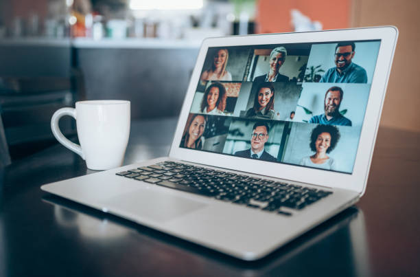 Laptop with a video conference call on the screen. Multi-ethnic business team using laptop for an online meeting in video call. web conference stock pictures, royalty-free photos & images