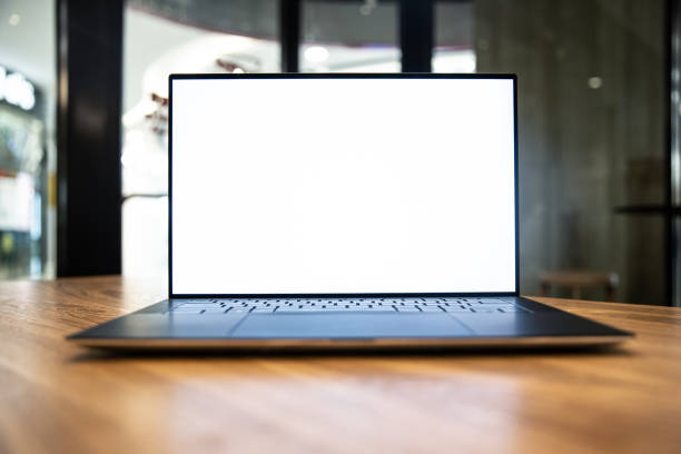 laptop with blank screen on table stock photo