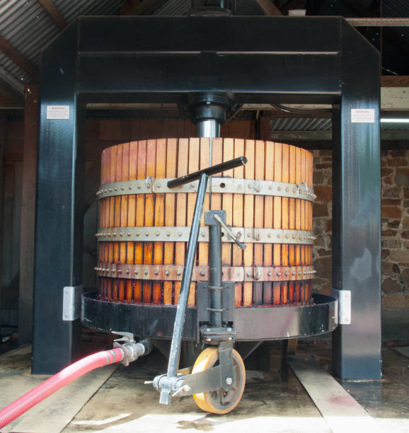 Large basket press in a traditional winery of the Barossa Valley of South Australia Large basket press used to press red wine grapes in a traditional winery of the Barossa Valley of South Australia Barossa Valley stock pictures, royalty-free photos & images
