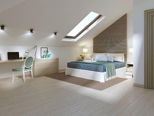 Large bedroom on the attic floor in a modern style. stock photo