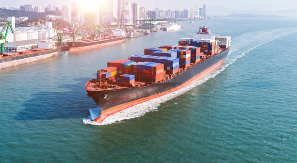 Large container ship arriving in the port stock photo