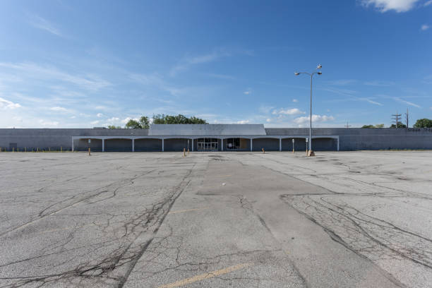 Large empty storefront and empty parking lot stock photo