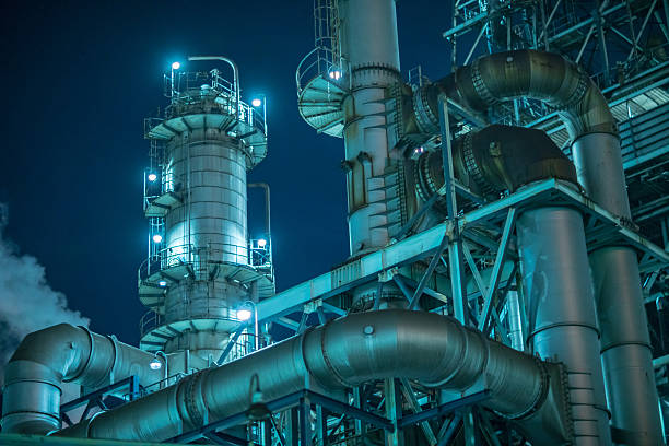 Large factory detail at night Details of large factory at night oil and gas plant stock pictures, royalty-free photos & images
