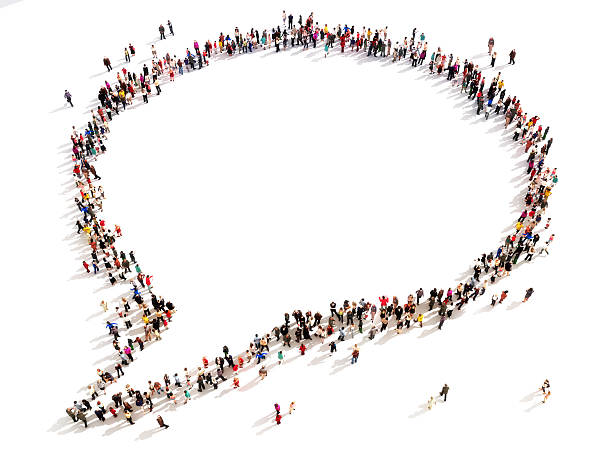 Large group of people in the shape of a chat bubble.  High angle view on a white background. Room for text or copy space large group of people stock pictures, royalty-free photos & images