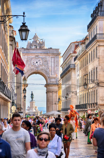 large group of people visit arco da rua augusta in praca do comercio lisbon, portugal - people portugal imagens e fotografias de stock