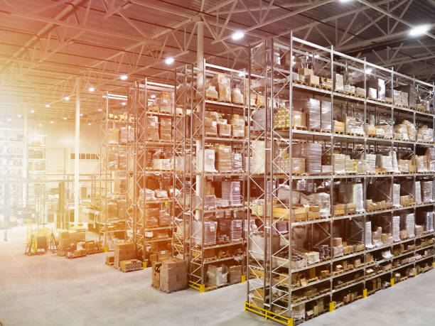 Large modern blurred warehouse industrial and logistics companies. Warehousing on the floor and called the high shelves stock photo