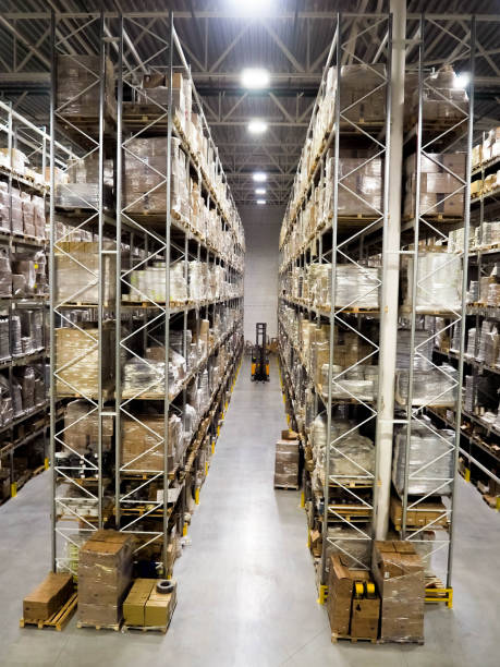 Large modern blurred warehouse industrial and logistics companies. Warehousing on the floor and called the high shelves stock photo
