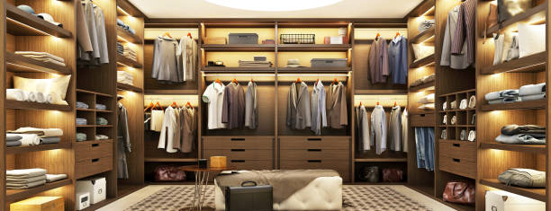 Large modern wardrobe with clothes with beautiful shelf lighting stock photo