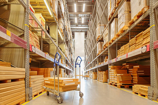 Large modern warehouse with shopping cart stock photo
