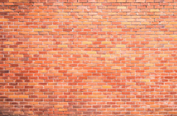 Large plain exterior brick wall stock photo