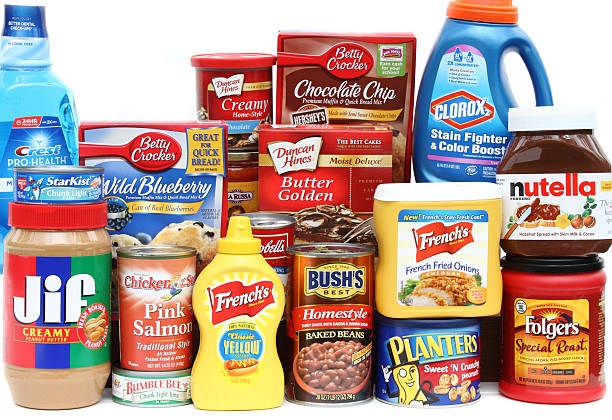 Large selection of brand name groceries West Palm Beach, USA - October 28, 2011: This is a studio product shot of a large selection of brand name groceries. In full view are Star Kist tuna, Jif peanut butter, Chicken of the Sea salmon, Bushs baked beans, Planters peanuts, Frenchs mustard and fried onions, Folgers coffee, and Nutella cocoa spread. Other products are partially visible in the background. This is a collection of some of the basic staples found in many American kitchens. jif stock pictures, royalty-free photos & images