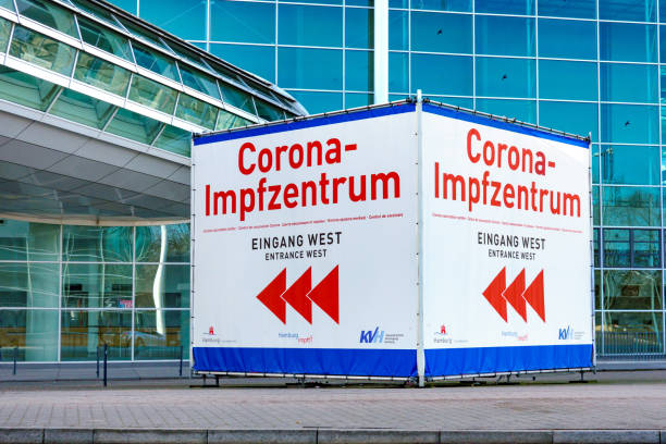 Large signpost to the Corona vaccination center in the Hamburg exhibition and congress halls stock photo