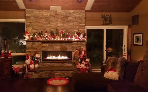 Large Stone Masonry Fireplace in a Rustic Mountain Lodge During Christmas Season stock photo