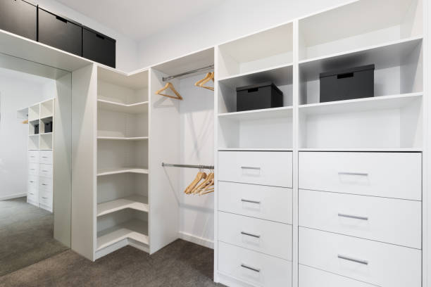 Large walk in wardrobe cabinetry detail in new home stock photo