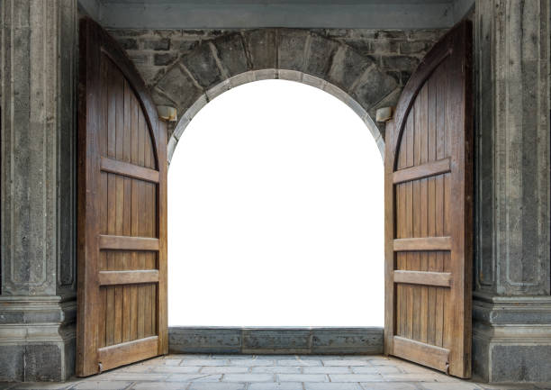 Large wooden door open in castle wall Large wooden door open in rock castle wall gate stock pictures, royalty-free photos & images