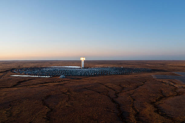 Last light on solar power generation in South African desert stock photo